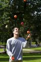 A man toss juggling balls in Boston Common public park in Boston, Massachusetts, USA. MR