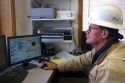 Operator using computers to monitar the system of a geothermal power plant in Malta, Idaho, USA. MR