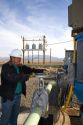 Operator turning a valve at a geothermal electric power plant in Malta, Idaho, USA. MR