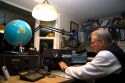 Ham radio operator in his radio shack located in Shelton, Washington, USA. MR