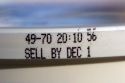 The sell by date on a pre-packaged food container.