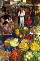 Vendors selling produce in the Ben Thanh Market located in Ho Chi Minh City, Vietnam.