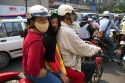 Vietnamese family riding a motorbike in Ho Chi Minh City, Vietnam.