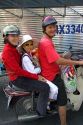 Vietnamese family ride a motorbike in Ho Chi Minh City, Vietnam.