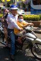 Vietnamese family ride a motorbike in Ho Chi Minh City, Vietnam.