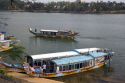Tourist boats on the Perfume River in front of the Thien Mu Pagoda  in Hue, Vietnam.