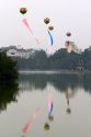 Tet decoration of large balloons float above Hoan Kiem Lake in Hanoi, Vietnam.