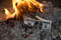 Vietnamese people burn photocopied U.S. dollars for good luck and prosperity in the coming year during Tet festivities in Hanoi, Vietnam.