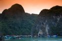Scenic views of limestone karsts and tourist boats in Ha Long Bay, Vietnam.