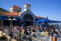 People dine outdoors in the town of Avalon on Catalina Island, California, USA.