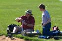 Father and son prepare to launch a model rocket for science education in Boise, Idaho.