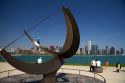 Cast bronze sundial sculpture named Man Enters the Cosmos by artist Henry Moore located on Lake Michigan outside the Adler Planetarium in Chicago, Illinois, USA.