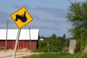 Tractor crossing road sign in Sauk County, Wisconsin, USA.