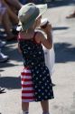 Child wearing a patriotic outfit while watching a 4th of July parade in Cascade, Idaho, USA.