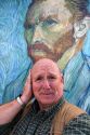 David R. Frazier stands in front of a Van Gogh self portrait outside of the Musee d'Orsay in Paris, France. MR