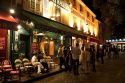 Restaurant exterior and nightlife in the Montmartre District of Paris, France.