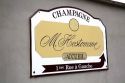 Sign for M. Hostomme Champagne winery in Chouilly, northeast France.