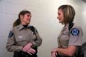 Female sheriff's deputies socialize in a county jail.