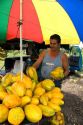 Street vendor selling papayas near Siquirres, Limon province, Costa Rica.
