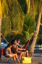 People relaxing in a hammock at Playa Carrillo near Samara, Costa Rica.
