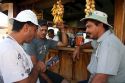 Server and customers at an outdoor cafe in Quepos, Costa Rica.