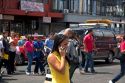 Costa Rican woman using a cell phone in San Jose, Costa Rica.