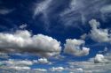 Cumulus and cirrus clouds with blue sky over Idaho, USA.