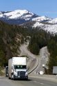 Vehicles travel on Interstate 80 near Donner Pass in the Sierra Nevada mountains, California, USA.