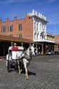Tourists ride in a horse drawn carriage at Old Sacramento State Historic Park in Sacramento, Califorina, USA.