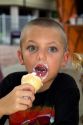 6 year old boy eating an ice cream cone in Brandon, Florida, USA. MR