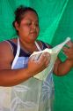 Native Pueblo woman making indian fry bread at Santo Domingo Pueblo, New Mexico, USA. MR
