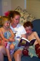 Mother reading to her children. MR