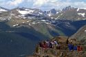 Tourists view the Rocky Mountains from a scenic overlook in the Rocky Mountain National Park, Colorado, USA.