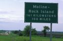 Road sign showing distance in kilometers and miles along Interstate 80 near Moline, Illinois, USA.