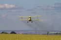 Crop duster spraying pesticide on a corn crop near Jerome, Idaho, USA.