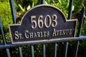 Address sign on the gate of the McCarthy House on Saint Charles Avenue in the Garden District of New Orleans, Louisiana, USA.