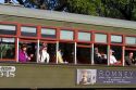 Passengers on the St. Charles Streetcar Line in the Garden District of New Orleans, Louisiana, USA.