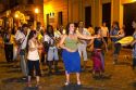People parade and dance along Defensa street in the San Telmo barrio of Buenos Aires, Argentina.