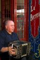 Argentine man playing the accordion in the La Boca barrio of Buenos Aires, Argentina.