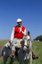 Gaucho riding horseback on the Pampas of Argentina.