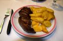 Meal of steak and fries in Buenos Aires, Argentina.