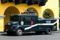 National police water cannon vehicle used for crowd control, parked at the Plaza Mayor or Plaza de Armas of Lima, Peru.