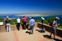 Tourists at a scenic overlook of San Diego and Coronado Island from Point Loma, California, USA.