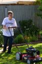 Teenage boy mowing a lawn in Boise, Idaho, USA. MR