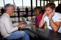 People use wi-fi internet at the Phoenix Sky Harbor International Airport located in the city of Phoenix, Arizona, USA.