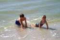 Brother and sister playing at Madeira Beach in Pinellas County, Florida, USA.