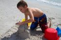 Seven year old boy playing at Madeira Beach in Pinellas County, Florida, USA.