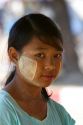 Portrait of a Burmese girl wearing thanaka on his cheeks in (Rangoon) Yangon, (Burma) Myanmar.