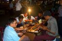 Burmese people eat and drink outdoors near the Sule Paya located in the heart of downtown (Rangoon) Yangon, (Burma) Myanmar.