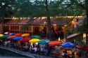Colorful umbrellas at the Casa Rio restaurant along the River Walk in San Antonio, Texas, USA.